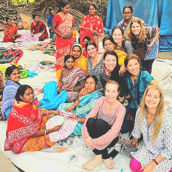 Women group producing hand stitched scarf